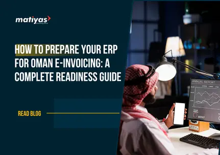 Business professional reviewing ERP dashboards and digital reports to prepare for Oman e-Invoicing compliance.